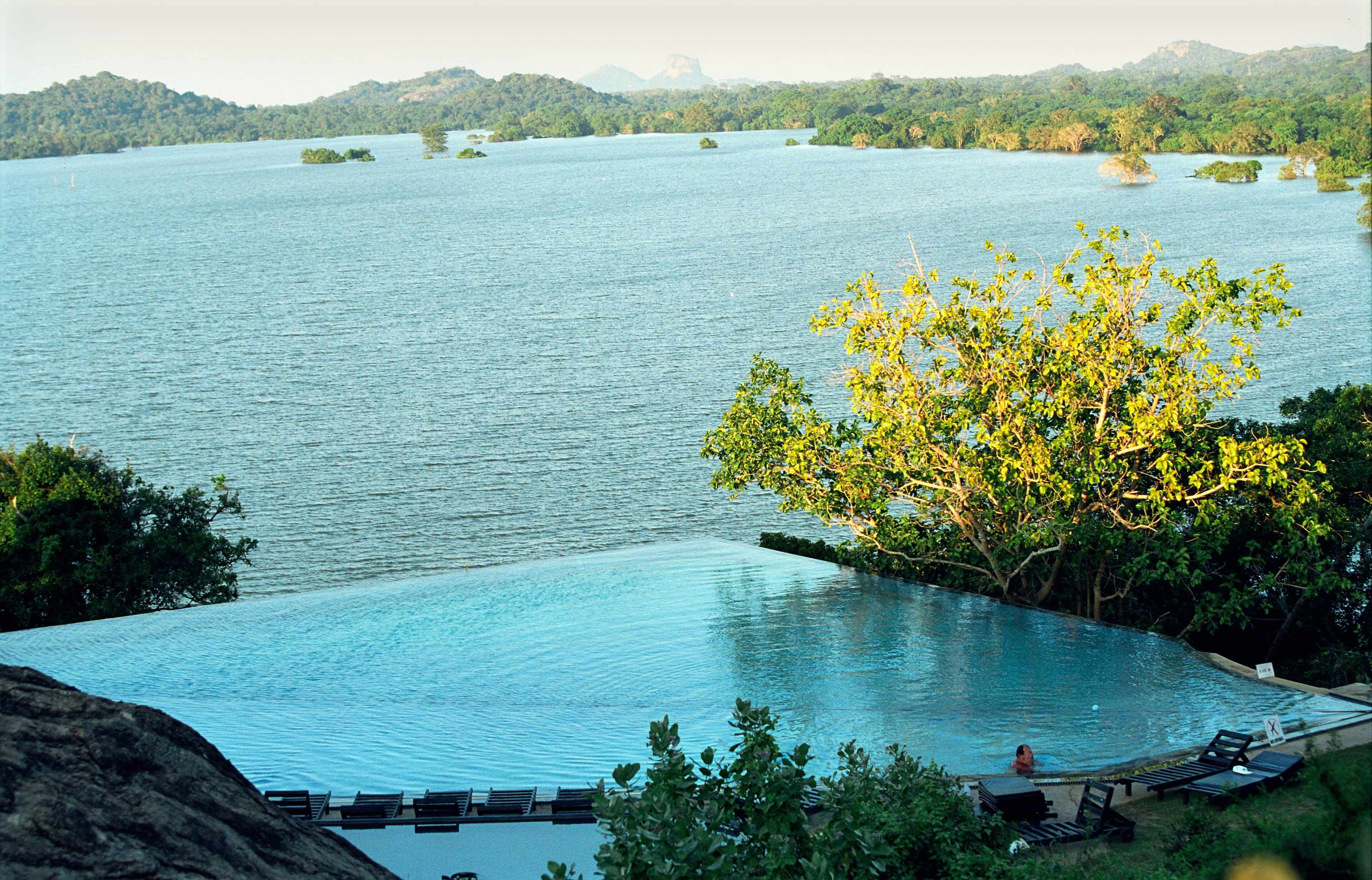 An infinity pool overlooking Kandalama lake and forest