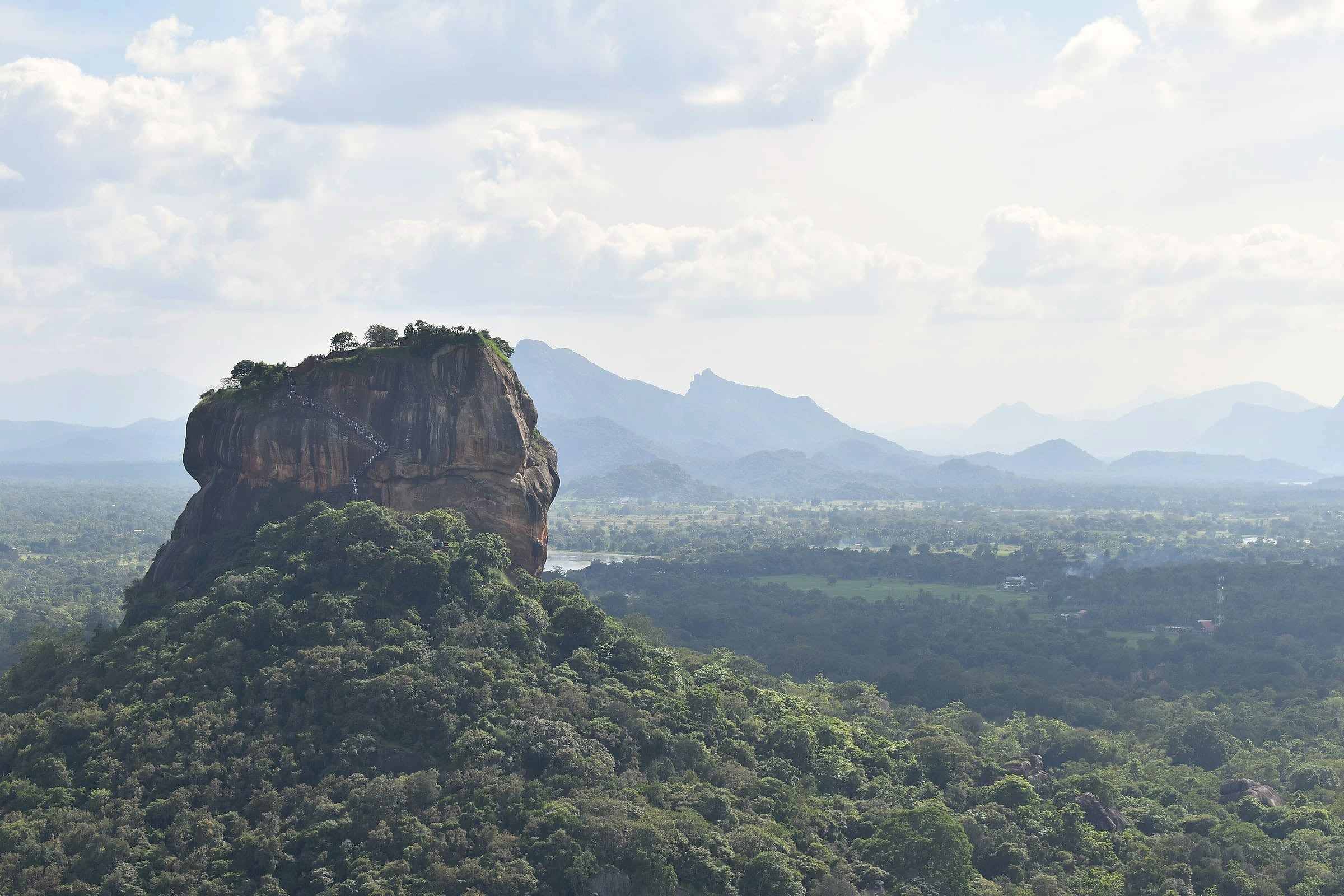 Sigiriya rock seen from above the surrounding plains and hills