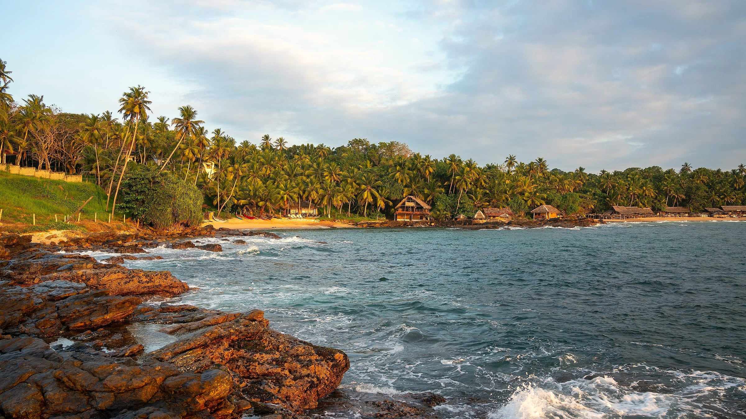 Palm-fringed Goyambokka Beach near Tangalle on the south coast