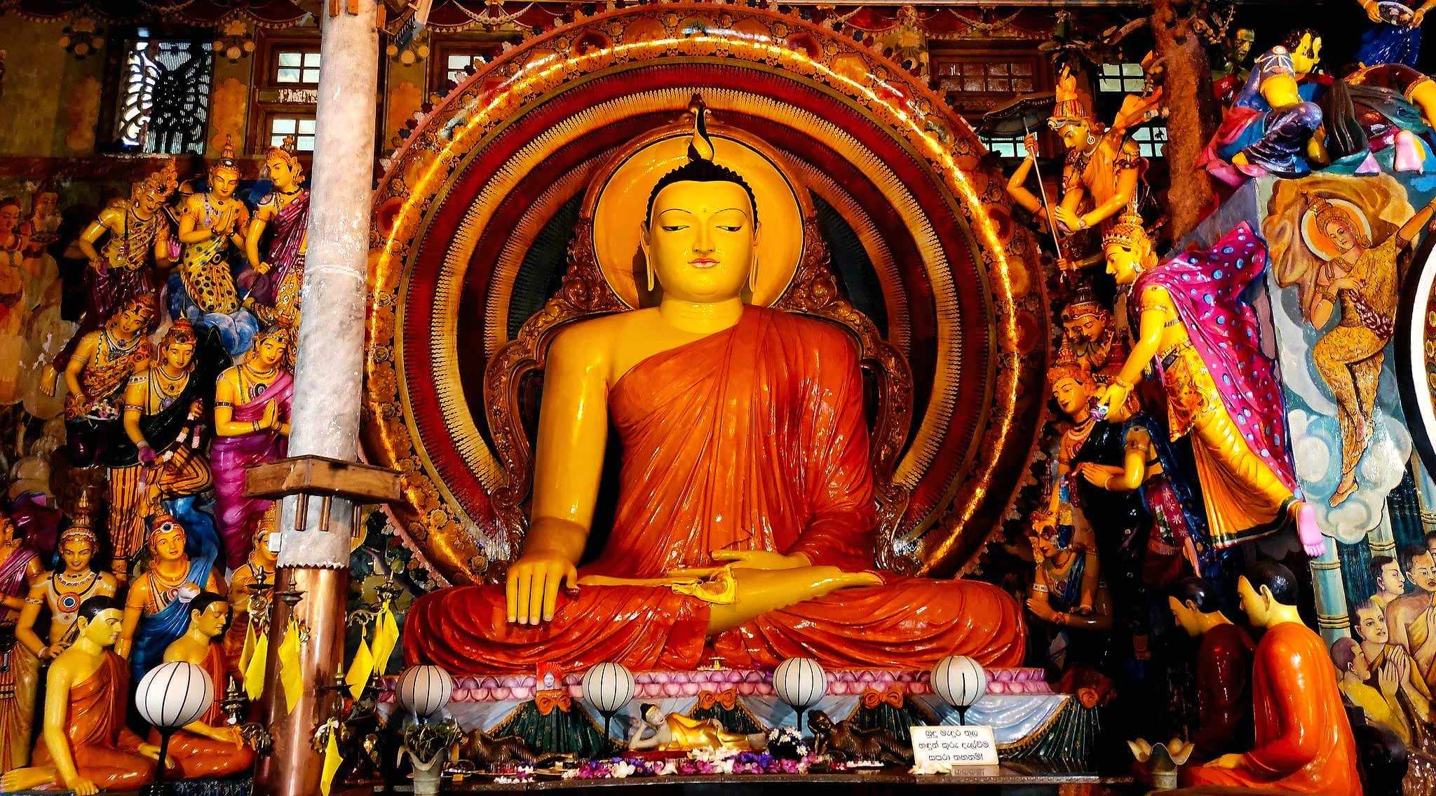 A golden Buddha statue in the shrine room of Gangaramaya Temple, Colombo